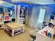 Charming bedroom with a decorative chandelier, organized closet, and makeup vanity area at 1744 Brookside Dr, Highlands Ranch, CO 80126