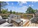 Outdoor deck area with seating, exercise equipment, and neighborhood views at 1744 Brookside Dr, Highlands Ranch, CO 80126