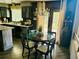 Eat in kitchen with wood floors, chandelier and natural light at 1744 Brookside Dr, Highlands Ranch, CO 80126