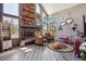 Cozy living room with a fireplace and ample natural light at 1744 Brookside Dr, Highlands Ranch, CO 80126