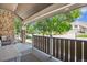 Inviting covered front porch with stone accents and wooden railing at 1744 Brookside Dr, Highlands Ranch, CO 80126