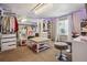 Spacious walk-in closet features ample storage, center island, and stylish lighting at 1744 Brookside Dr, Highlands Ranch, CO 80126