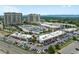 Aerial view of a condo community featuring retail spaces, parking, and nearby mountain views at 5455 Landmark Pl # 815, Greenwood Village, CO 80111