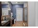 An elegant bathroom features double sinks and a glass enclosed shower with an intricate wall pattern at 5455 Landmark Pl # 815, Greenwood Village, CO 80111