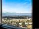 Scenic city view highlighting a mountain range against the blue sky, seen through a window at 5455 Landmark Pl # 815, Greenwood Village, CO 80111