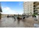 Stylish outdoor patio featuring a cozy seating area with a stone fireplace at 5455 Landmark Pl # 815, Greenwood Village, CO 80111