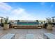 Relaxing rooftop pool with lounge chairs overlooking the cityscape and mountains at 5455 Landmark Pl # 815, Greenwood Village, CO 80111