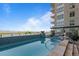 Modern rooftop pool with mountain views and refined seating at 5455 Landmark Pl # 815, Greenwood Village, CO 80111