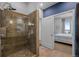 A tiled glass shower adjacent to an en suite bedroom at 5455 Landmark Pl # 815, Greenwood Village, CO 80111