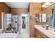 Bathroom featuring double sinks, a shower and garden tub at 19602 E 63Rd Dr, Aurora, CO 80019