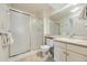 Bright bathroom with a glass-enclosed shower and a modern vanity with sink at 2164 S Troy Way, Aurora, CO 80014
