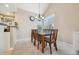 Cozy dining room with chandelier lighting and views of the outdoors at 2164 S Troy Way, Aurora, CO 80014