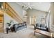 Open living room featuring vaulted ceilings, staircase, and lots of natural light at 2164 S Troy Way, Aurora, CO 80014