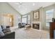Cozy living room with fireplace, ample seating, and lots of natural light at 2164 S Troy Way, Aurora, CO 80014