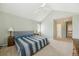 Calm bedroom with a large window providing natural light and vaulted ceilings at 2164 S Troy Way, Aurora, CO 80014