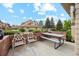 Private brick patio with outdoor seating, perfect for relaxing and entertaining guests at 2164 S Troy Way, Aurora, CO 80014