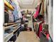 Spacious walk-in closet featuring shelving and hanging storage, perfect for organization at 2164 S Troy Way, Aurora, CO 80014
