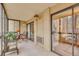 Enclosed balcony with outdoor furniture offers a cozy space to relax, protected from the elements at 13631 E Marina Dr # 105, Aurora, CO 80014