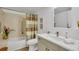Well-maintained bathroom features a shower-tub combo with neutral toned vanity and fixtures at 13631 E Marina Dr # 105, Aurora, CO 80014