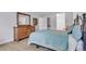 Comfortable bedroom with a large bed and wood dresser at 13631 E Marina Dr # 105, Aurora, CO 80014
