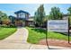 Building exterior and sign with landscaped lawn and sidewalk, promoting open access at 13631 E Marina Dr # 105, Aurora, CO 80014