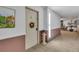 Inviting hallway featuring neutral carpet and decor at 13631 E Marina Dr # 105, Aurora, CO 80014