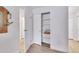 Hallway showing closet storage with shelving and sliding doors, ideal for organizing personal items at 13631 E Marina Dr # 105, Aurora, CO 80014