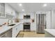 This is a kitchen with stainless steel appliances and bright white cabinets at 13631 E Marina Dr # 105, Aurora, CO 80014