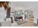 Office featuring a desk, vintage chair, decor, and a sliding glass door to the balcony at 13631 E Marina Dr # 105, Aurora, CO 80014