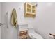 This bathroom is equipped with storage shelves, and drawers for toiletries, next to the toilet at 13631 E Marina Dr # 105, Aurora, CO 80014