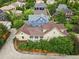 Neighborhood view, showcasing a home with trees, a fence, and a front porch at 9134 E 29Th Pl, Denver, CO 80238