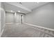 Finished basement with neutral carpet, ample space, and recessed lighting, ideal for Gathering activities at 9134 E 29Th Pl, Denver, CO 80238