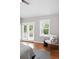Bright bedroom with vaulted ceilings, hardwood floors and modern decor near french doors at 9134 E 29Th Pl, Denver, CO 80238