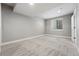 Neutral bedroom with grey carpet, white trim, and a window at 9134 E 29Th Pl, Denver, CO 80238