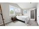 Bright bedroom with 3 windows and ladder as decor, featuring soft carpet and a view of the outdoors at 9134 E 29Th Pl, Denver, CO 80238