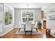 Bright dining room features hardwood floors and plenty of natural light at 9134 E 29Th Pl, Denver, CO 80238