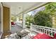 Relaxing covered front porch with seating offers a peaceful outdoor space at 9134 E 29Th Pl, Denver, CO 80238