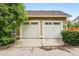 Two-car garage with white doors, offering ample parking and storage at 9134 E 29Th Pl, Denver, CO 80238