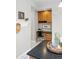 Attached office space with desk, cabinet storage, and decor near the open-concept kitchen at 9134 E 29Th Pl, Denver, CO 80238