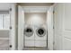 Convenient laundry closet with stacked washer and dryer units for space-saving efficiency at 9134 E 29Th Pl, Denver, CO 80238