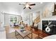 Open concept living room flows into dining area, perfect for entertaining at 9134 E 29Th Pl, Denver, CO 80238