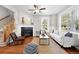 Cozy living room boasts a fireplace, hardwood floors, and stylish accents at 9134 E 29Th Pl, Denver, CO 80238