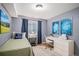 Well-lit bedroom features neutral walls, complementing bed linens, and a bright window at 510 W Prestwick Way, Castle Rock, CO 80104
