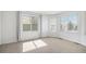 Bright, airy bedroom with soft carpet, large windows, and neutral decor for a calming atmosphere at 510 W Prestwick Way, Castle Rock, CO 80104