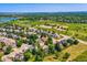 Panoramic aerial shot featuring a neighborhood surrounded by green spaces and a baseball field at 12534 W Hoover Ave, Littleton, CO 80127