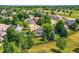 Aerial view of a residential area near a green space with baseball fields and mature trees at 12534 W Hoover Ave, Littleton, CO 80127