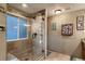 Bathroom featuring a glass shower, tile, and decor at 12534 W Hoover Ave, Littleton, CO 80127