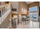 View of the dining room and stairs with a view of the living room at 12534 W Hoover Ave, Littleton, CO 80127
