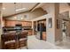 Spacious kitchen with granite countertops, stainless steel appliances, custom cabinetry, and an open layout at 12534 W Hoover Ave, Littleton, CO 80127