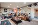 Spacious finished basement living area with Broncos themed decor at 12534 W Hoover Ave, Littleton, CO 80127